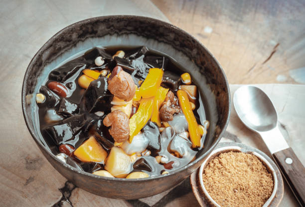 istock Black Grass Jelly is including Nuts, Cereals, Red beans, Ginkgo, Sliced pumpkin, Corn kernels, Millet, Sweet potato, Palm seed and Jelly in Longan Juice which is served with Brown sugar. 1645269694