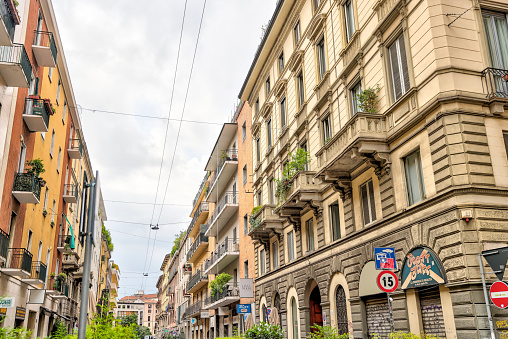 Milan, Italy - July 12, 2022: Classic architecture and building facades on the streets in Milan