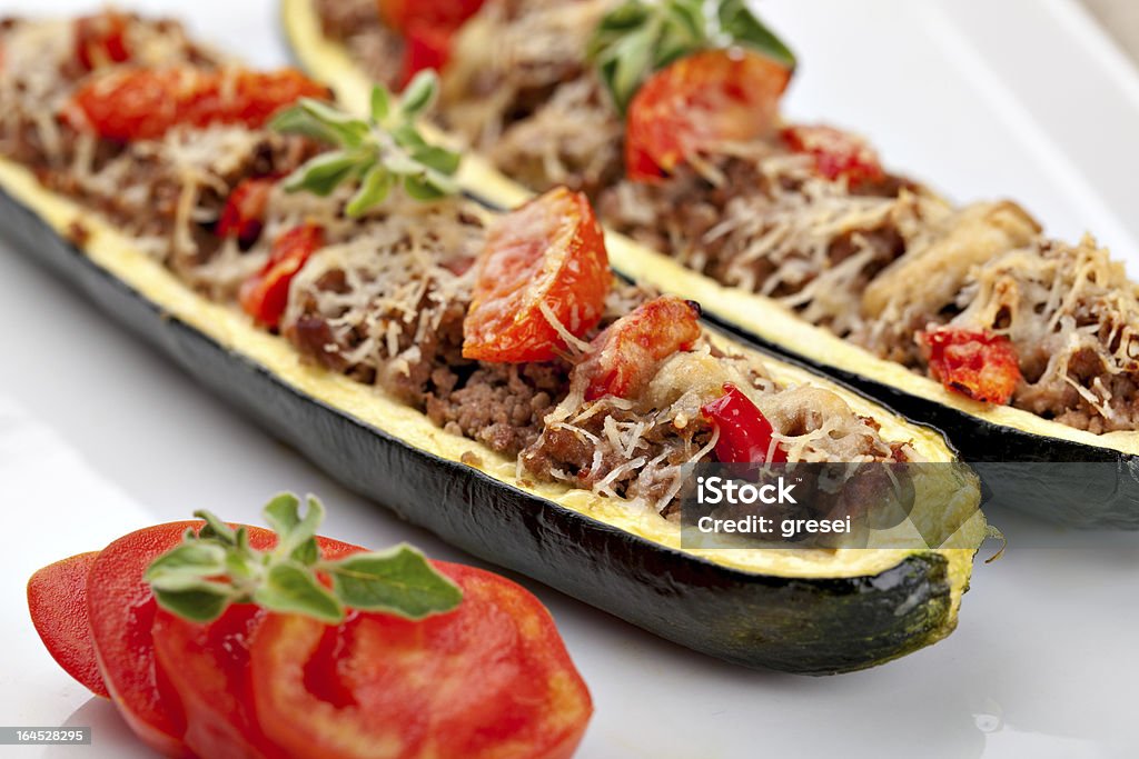 Zucchini halves stuffed with minced meat Zucchini halves stuffed with minced meat and vegetable Baked Stock Photo