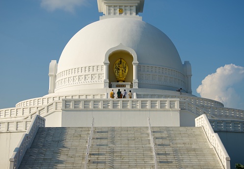 Lumbini, Nepal-February 29, 2012: Pilgrims at Lumbini Peace Pagoda