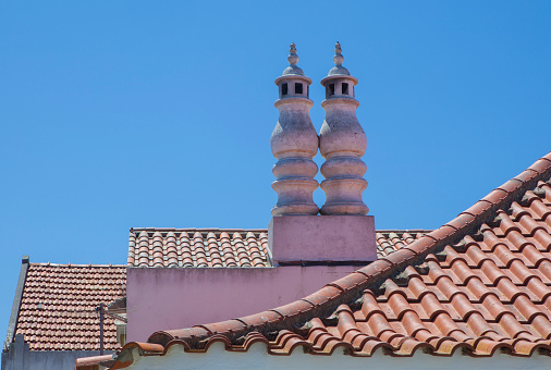 Plastered masonry twin chimneys, Vila Nova de Milfontes, Alentejo coast, Portugal