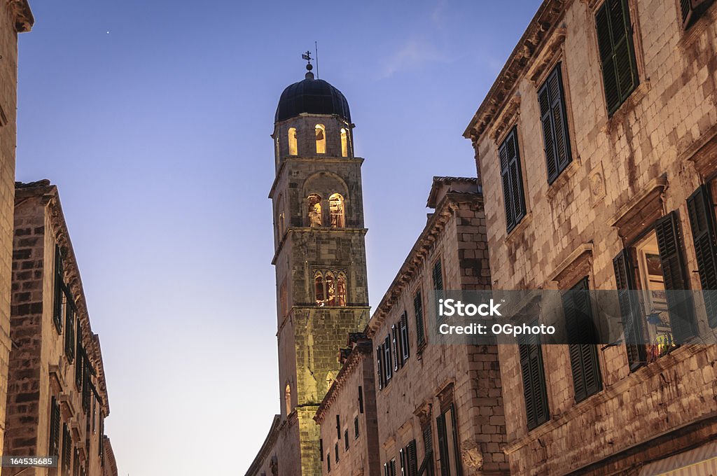 Bell tower at night in the city of Dubrovnik, Croatia The bell tower of the Franciscan Monastery in the fortified medievel city of Dubrovnk, Croatia. Adriatic Sea Stock Photo