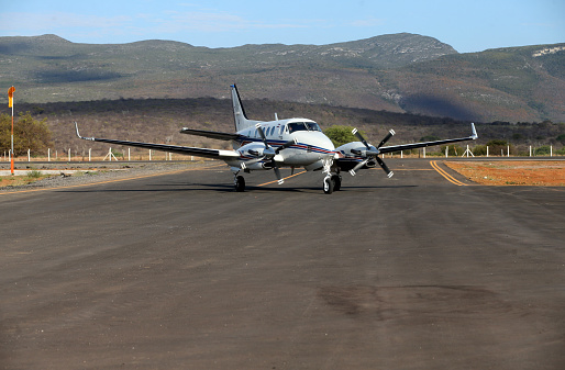 Aerial view of an airport terminal with turbo prop aircraft.