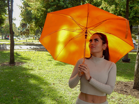 woman with an umbrella in a park