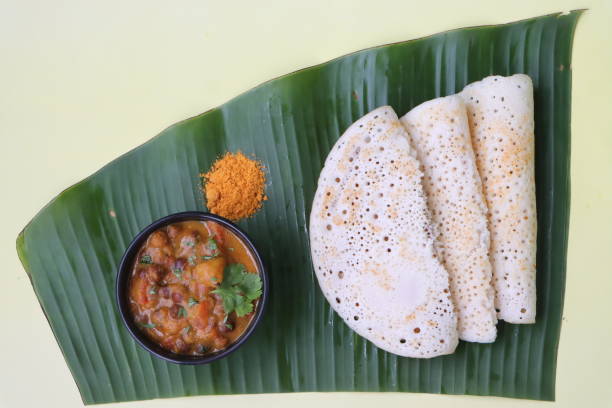 istock Set dosa served with black chana curry and podi, or sponge dosa, thick fluffy and soft made with rice, urad dal, fenugreek seeds and poha 1645459561