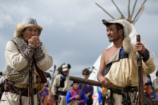 Ulaanbaatar, Tuv, Mongolia - August 12, 2023: Tsaatan hunters are talking. Nomads world cultural festival Mongolia