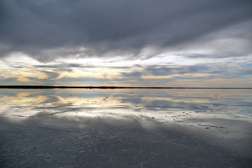 Sky reflecting on the salty surface of Lake hart, a large salt lake near the town of Woomera, South Australia.