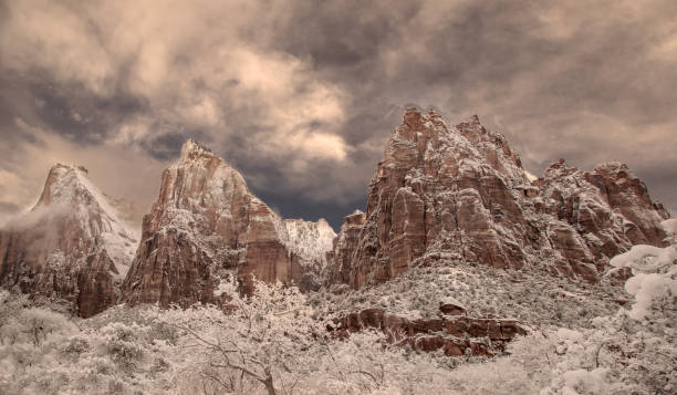 Zion Canyon Winter Fresh snow has fallen at the Court Of The Patriarchs in Zion Canyon at at Zion National Park, Utah zion river stock pictures, royalty-free photos & images