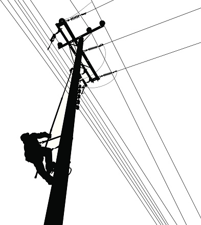 Electric Worker in power lines instalation process