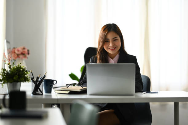 istock Image of happy millennial female financier checking statistic data on laptop screen 1645567484