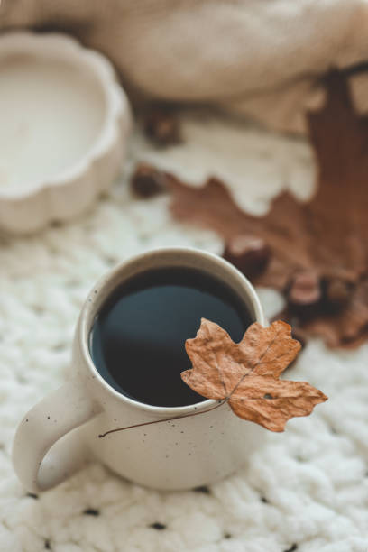 istock Cup of hot tea and a leaf, autumn mood 1645600372