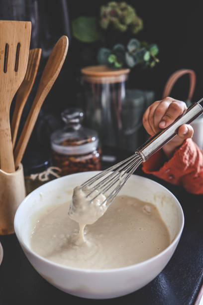 istock Kneading dough for pancakes, cooking homemade breakfast 1645600474