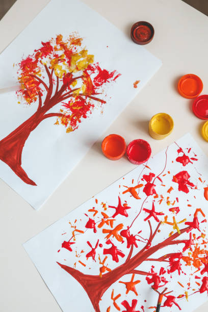 istock Children's creativity, autumn drawing with paints close-up 1645600847