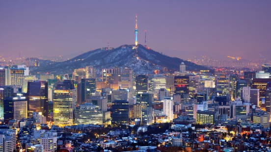 Downtown skyline of Seoul, South Korea with Seoul Tower atop Namsan Mountain.