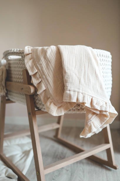 istock Muslin blanket on the cradle in the children's room 1645602009