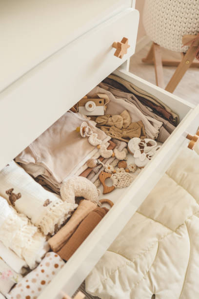 istock Open bedside table with things for newborns, concept in anticipation 1645602230
