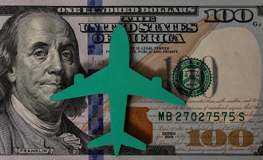 The symbolic figure of an airplane on a bill of denomination of 100 US dollars