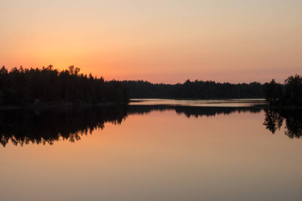 istock calm sunset on the forest lake 1645603863
