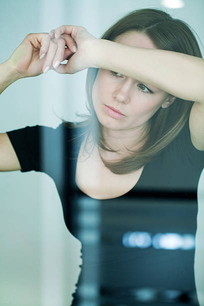 istock sad woman at the window 164562452