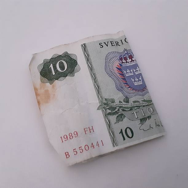 istock Old stained swedish ten krona bill. 1645640512