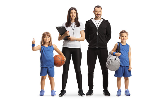 PE teachers with children in basketball jerseys isolated on white background