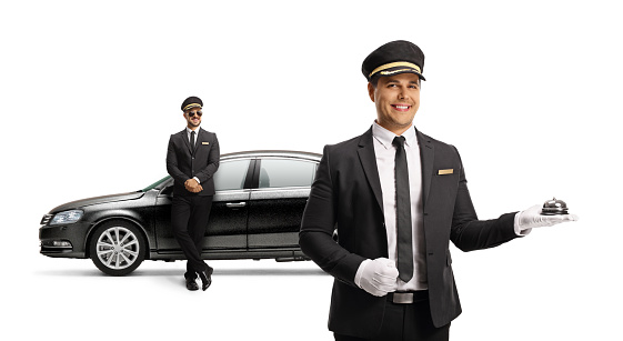 Professional chauffeurs with a black car isolated on white background