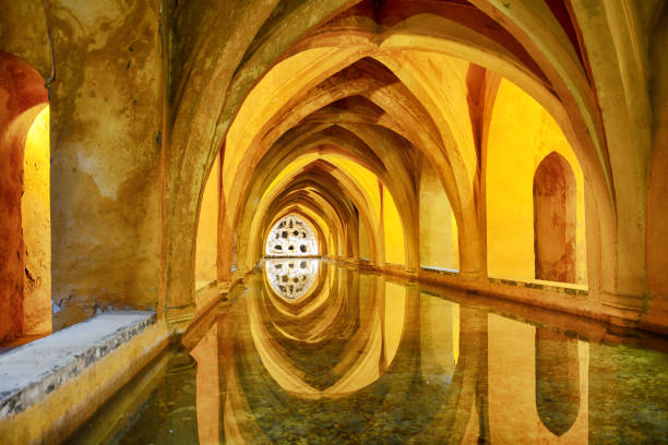 The Baths of Dona Maria de Padilla under the lights in Seville, Spain