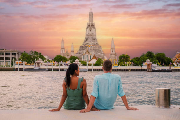 istock Wat Arun temple Bangkok during sunset in Thailand. Chao praya river at sunset 1645708708