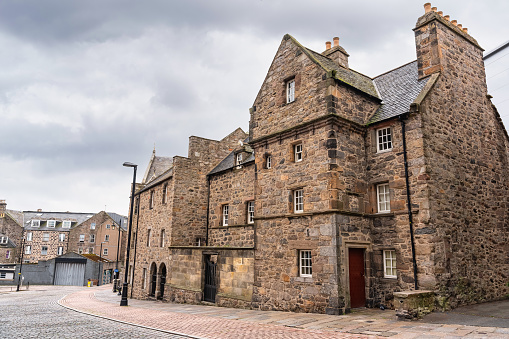 Very old picturesque stone houses in the center of the Scottish city of Aberdeen, UK