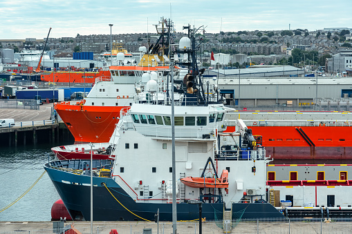 Large ships docked in the industrial port of Aberdeen, Scotland, UK