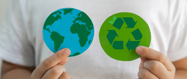 istock Hand holding paper cut saving clean energy earth globe world environment green eco friendly, save planet, csr social responsibility.campaign save the earth and earth Day 22 April 1645729484