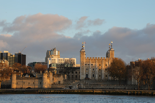 Medieval (founded in 1066) Tower of London fortress with River Thames in the foreground