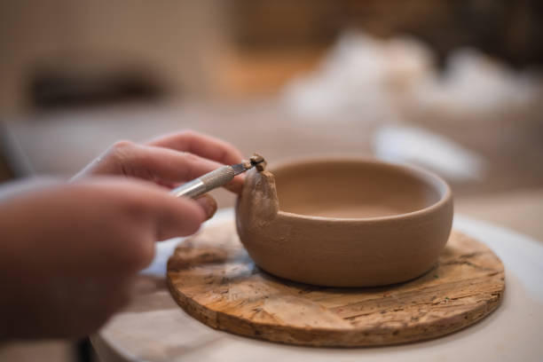 istock girl hands, pottery studio and painting cup in workshop for sculpture 1645829859