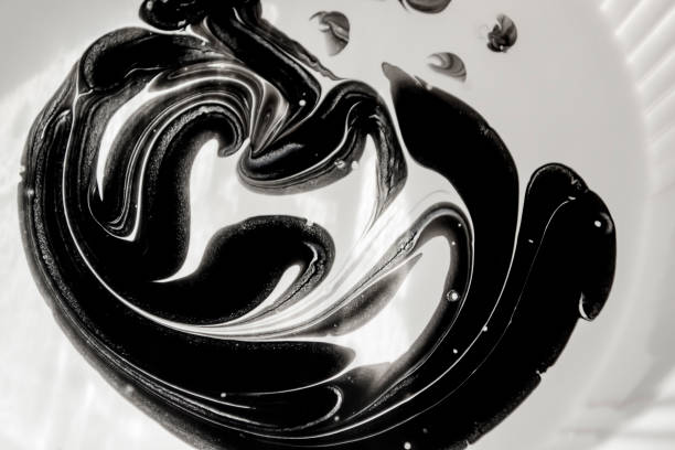 istock abstract background. Black and white paint are mixed - abstraction. Abstract drawing when mixing black and white paint. 1645834632