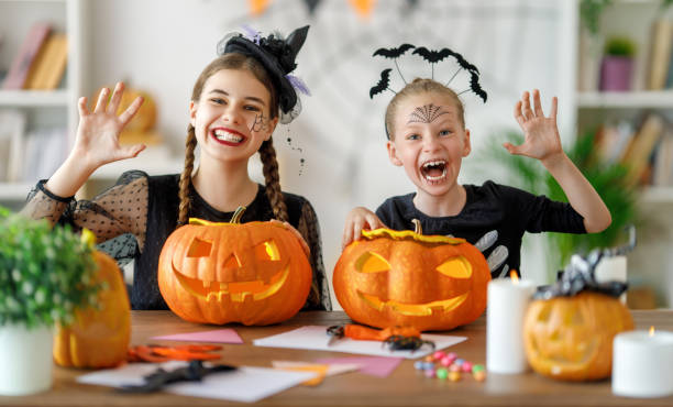 istock Happy family preparing for Halloween. 1645835673