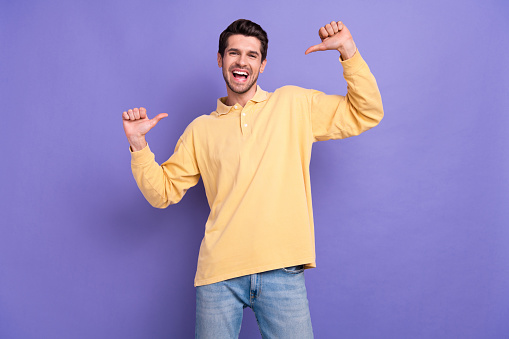Photo of cheerful nice person have good mood point thumb fingers self himself isolated on violet color background.