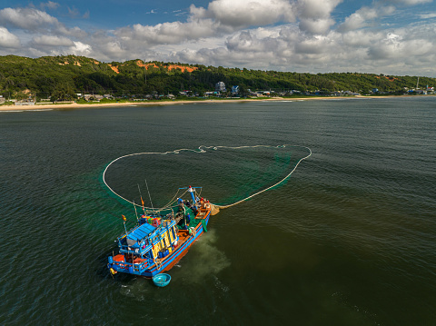 Drone view of fishing boat is netting on the sea of Ke Ga, Binh Thuan province, central Vietnam