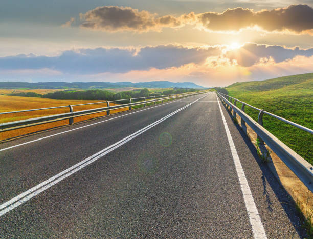 istock Highway into the sunset in Tuscany, Italy 1645846679