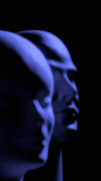 two blurred mannequins heads illuminated by blue theatrical light