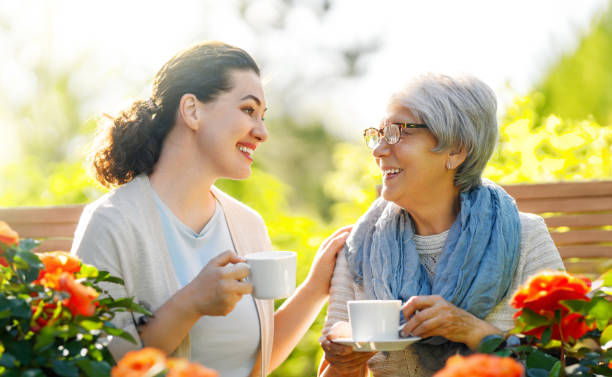 istock women drinking tea in the garden 1645862135