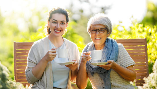 istock women drinking tea in the garden 1645862136