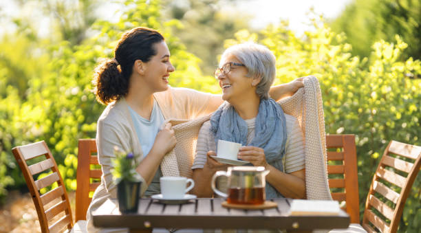 istock women drinking tea in the garden 1645862711