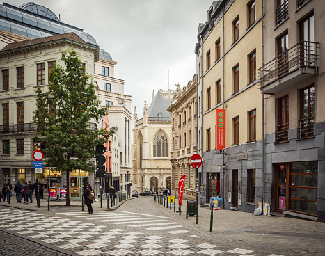 Brussels, Belgium - October 06 2014: Narrow street with shops and cafes in Brussel old town.