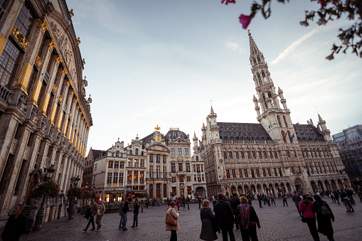 Brussels, Belgium - October 08 2014: Town Hall and guildhouses on Grand Place - the central square of Brussels with numerous tourist shops and caffes.