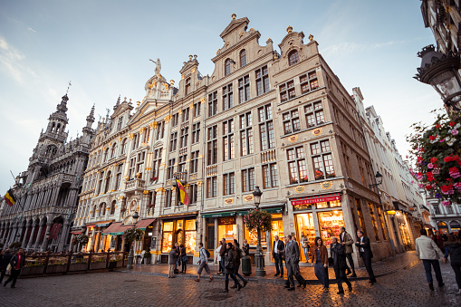 Brussels, Belgium - October 08 2014: Facades of guildhouses on Grand Place - the central square of Brussels with numerous tourist shops and caffes.