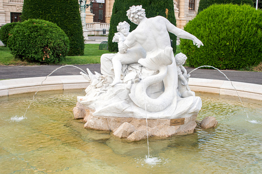 Vienna, Austria 8 Aug 2023. Mythical Fountain: Admire the enchanting Triton and Naiad Fountain, a masterpiece from 1890, gracing Vienna's Maria Theresien Platz in front of the Natural History Museum.