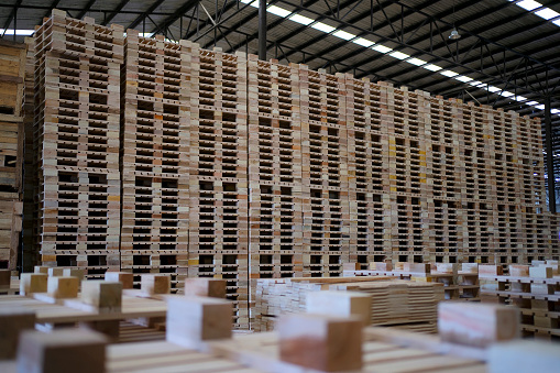 Stack of wooden pallet in warehouse  storage. Material for Industry and transportation
