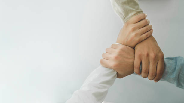 istock Close up hands Teamwork group of multi racial people meeting join hands. 1645903163