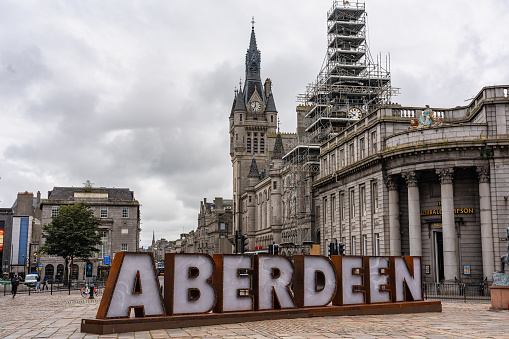 Aberdeen, Scotland, August 17, 2023: The city's Mercat Cross Square with the city's name sign