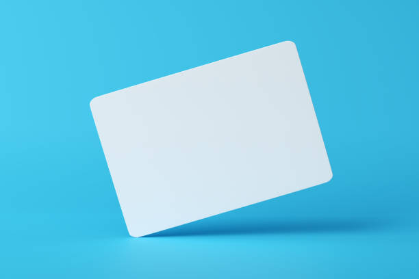 istock Mockup of a blank white business card hovering on blue background. 1645908423